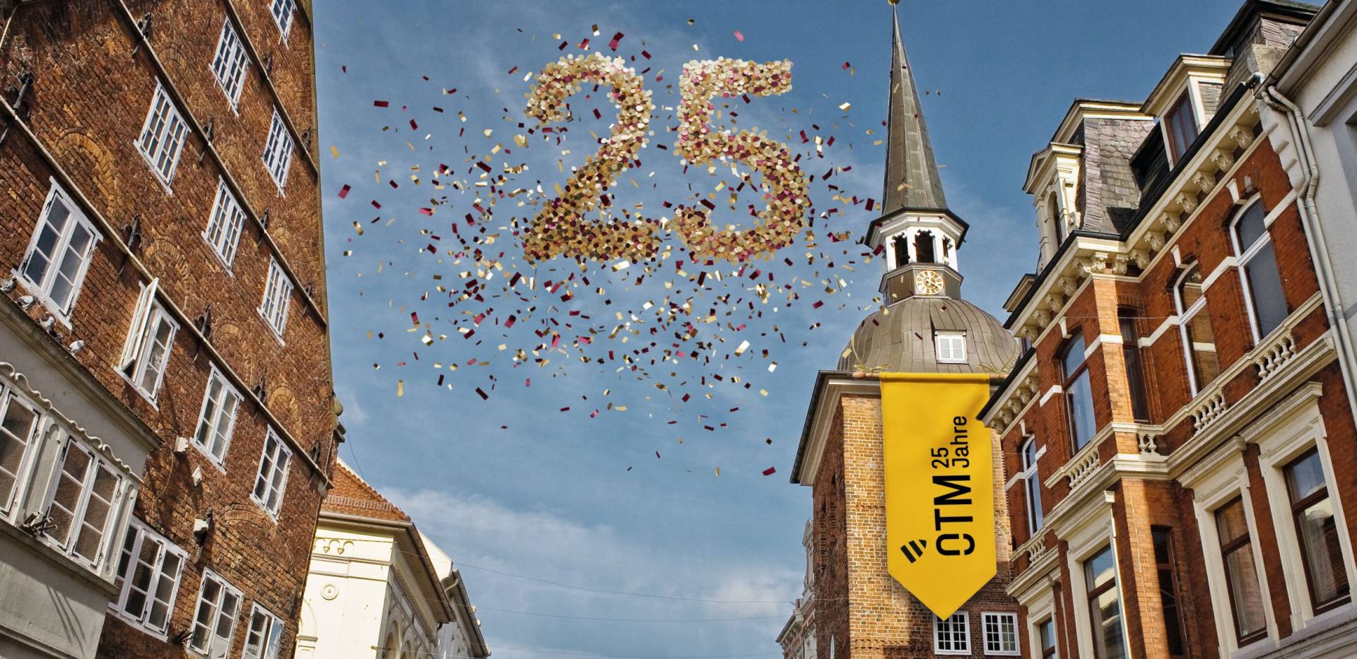 Der Lappan mit einer Banderole, dem Jubil&auml;umslogo und der Zahl 25 aus Konfetti. 